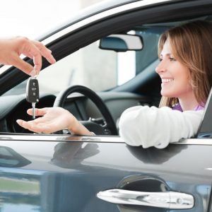 dealer handing over key