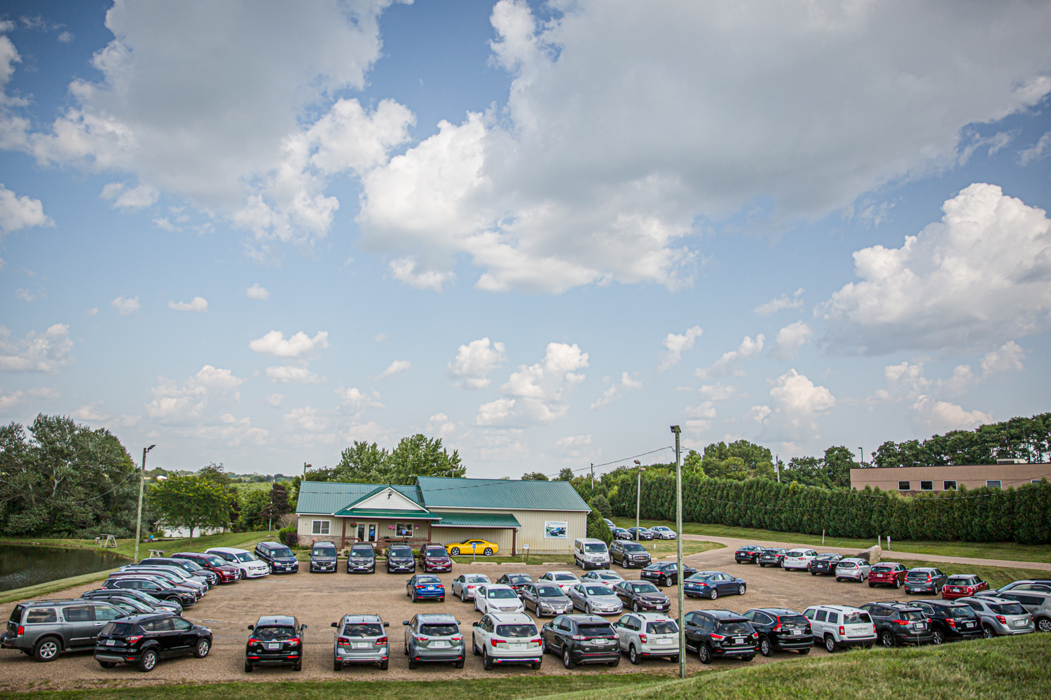 Photo of the entire selection of preowned minivans, crossovers, trucks, SUVs and cars at Warehouse Auto near Cedar Rapids and Iowa city