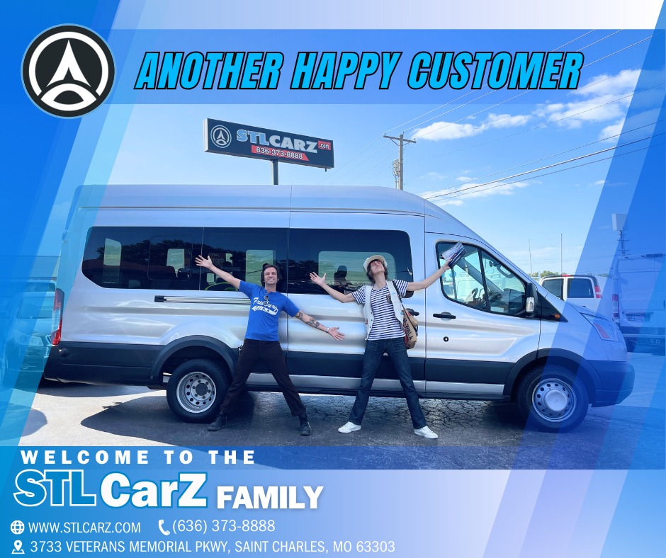 Happy customers standing smiling in front of the silver Cargo Van iat STLCarZ lot