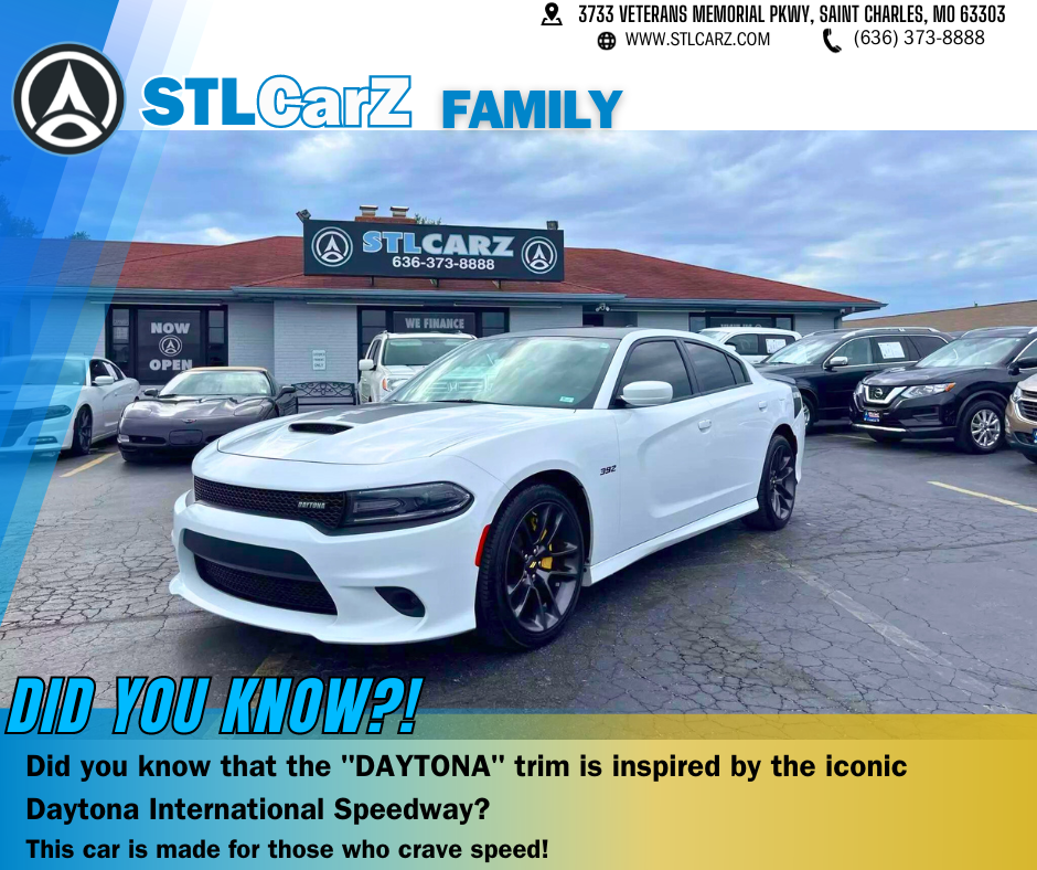 A White Dodge Charger Dayton at STLCarZ Lot with the words about Dayton name brand