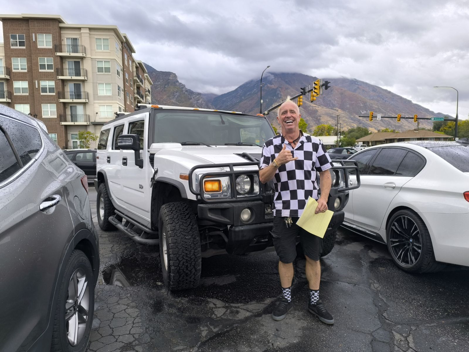 Man in front of his new Hummer H2 in Provo, Utah