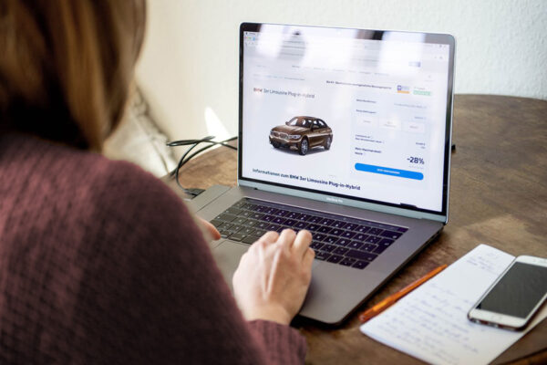 woman buying car online in her laptop