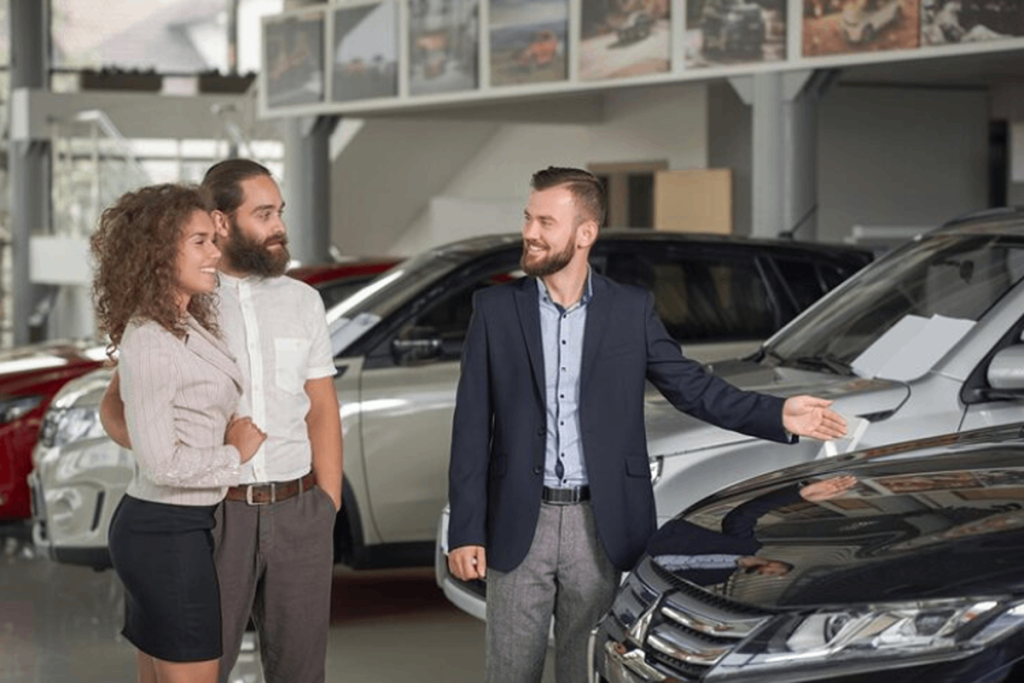 Car salesman showing a used car