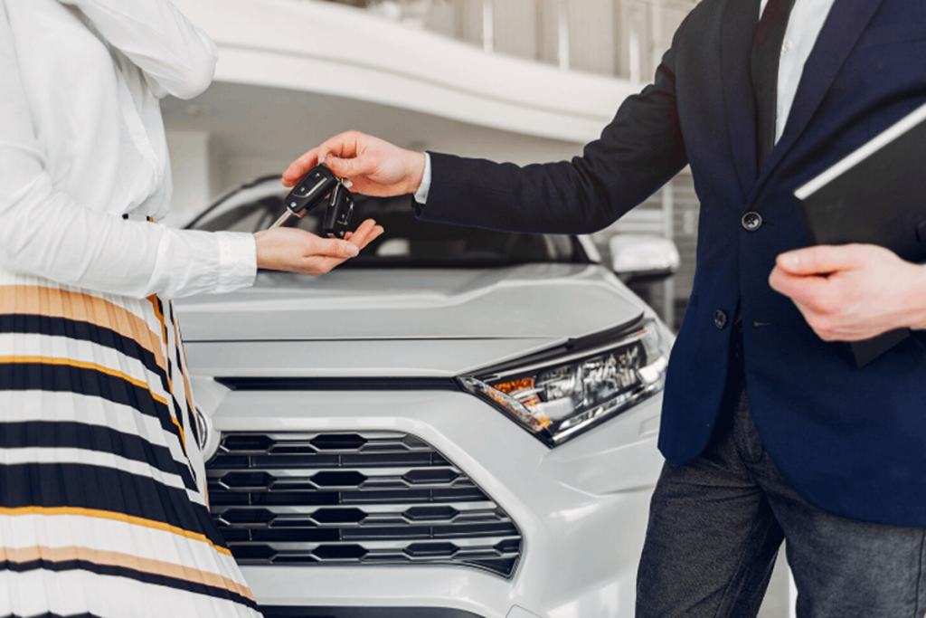 Woman getting the keys to her new car