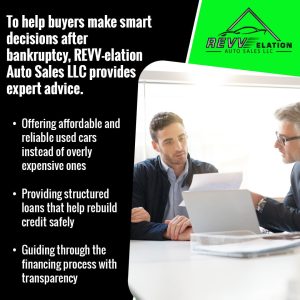 A car sales professional in an office, discussing financing documents with a man, representing expert advice for buyers after bankruptcy.