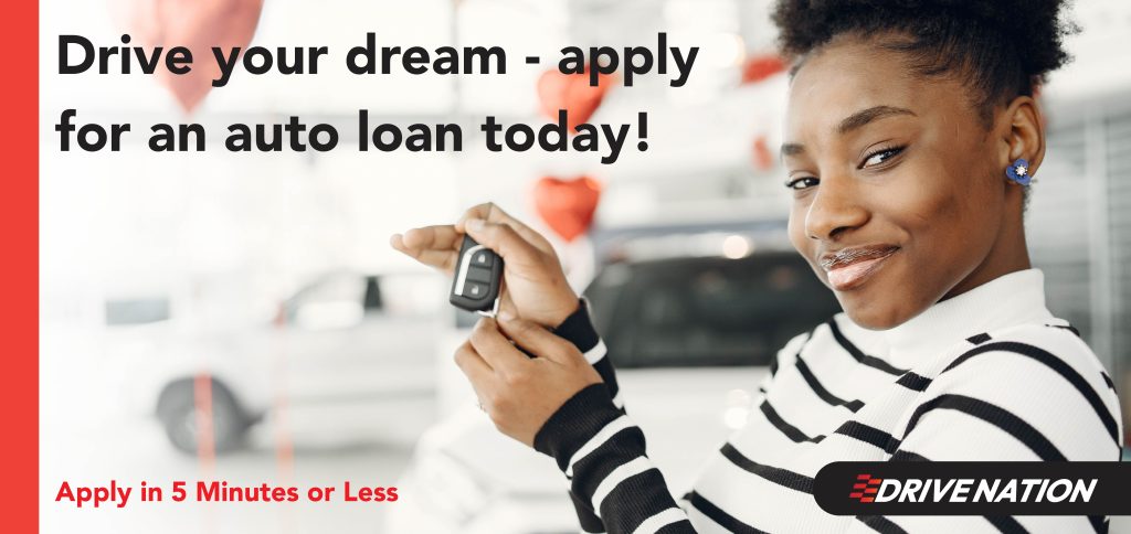 Woman holding car keys and smiling. Drive Your Deam - Apply for an Auto Loan today.