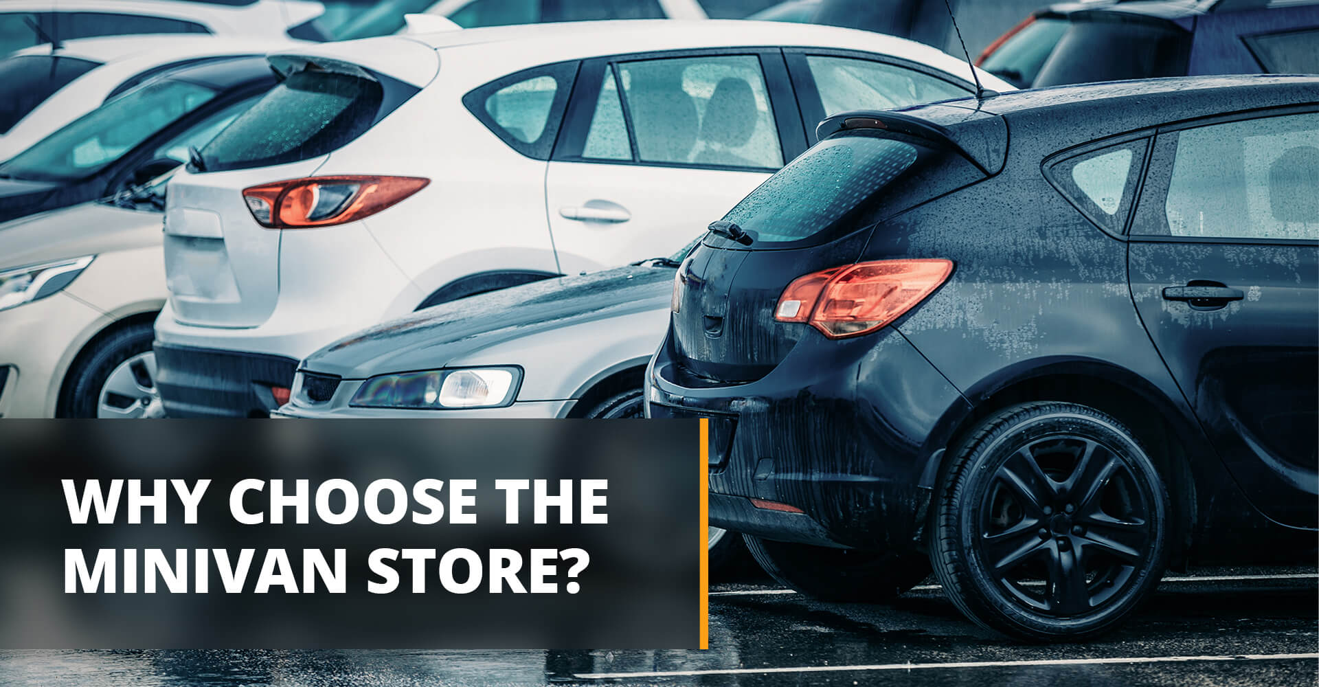 Cars on a used car lot sitting in the rain. 