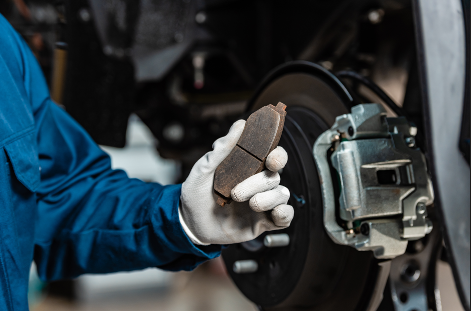 Technician shows a single brake pad