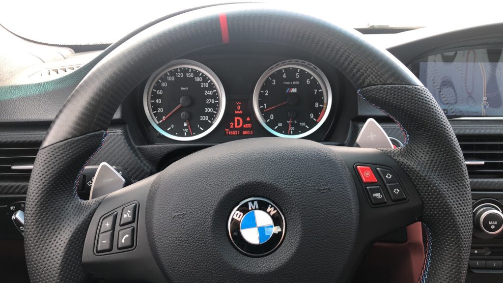 crooked steering wheel due to misalignment