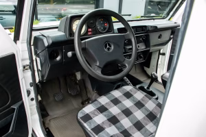 Interior view of a classic white Mercedes G-Wagon