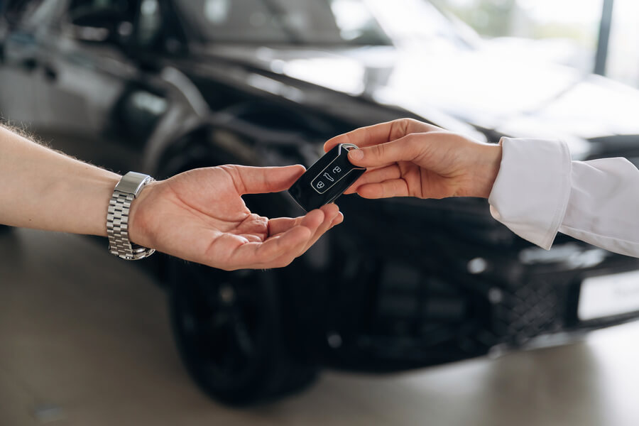 Income tax refund - Car keys being handed over.
