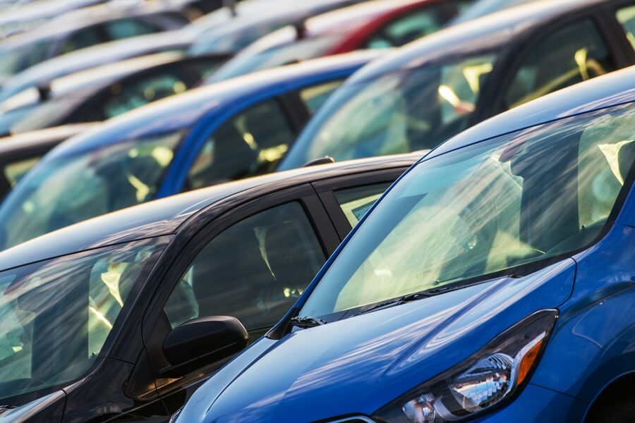 Income taxes florida - Rows of cars parked at a dealership.