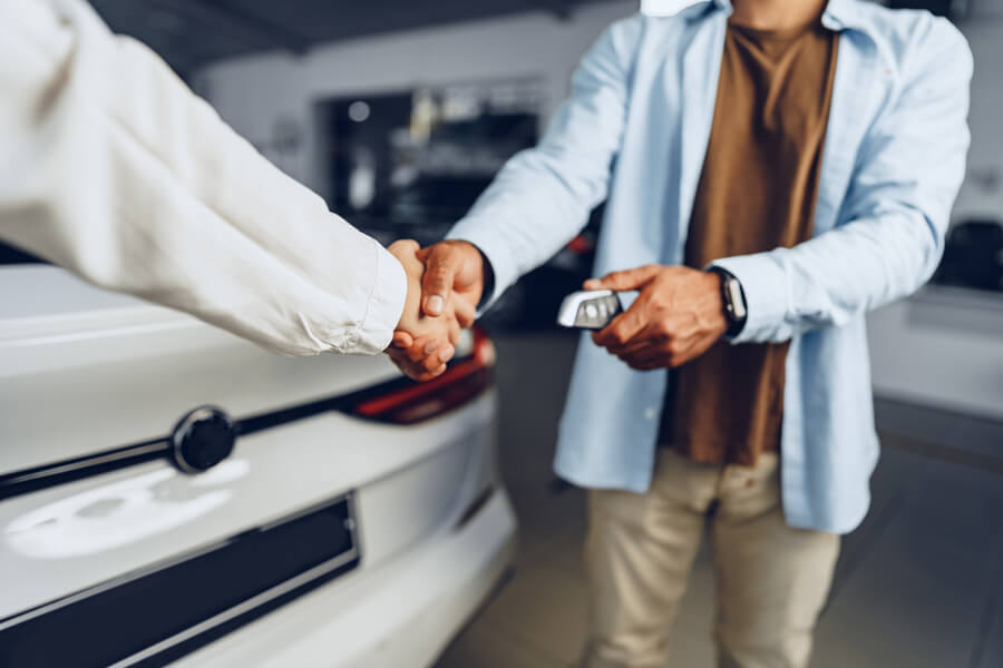 Is income tax refund considered income - Person plugging an electric car into a charger.