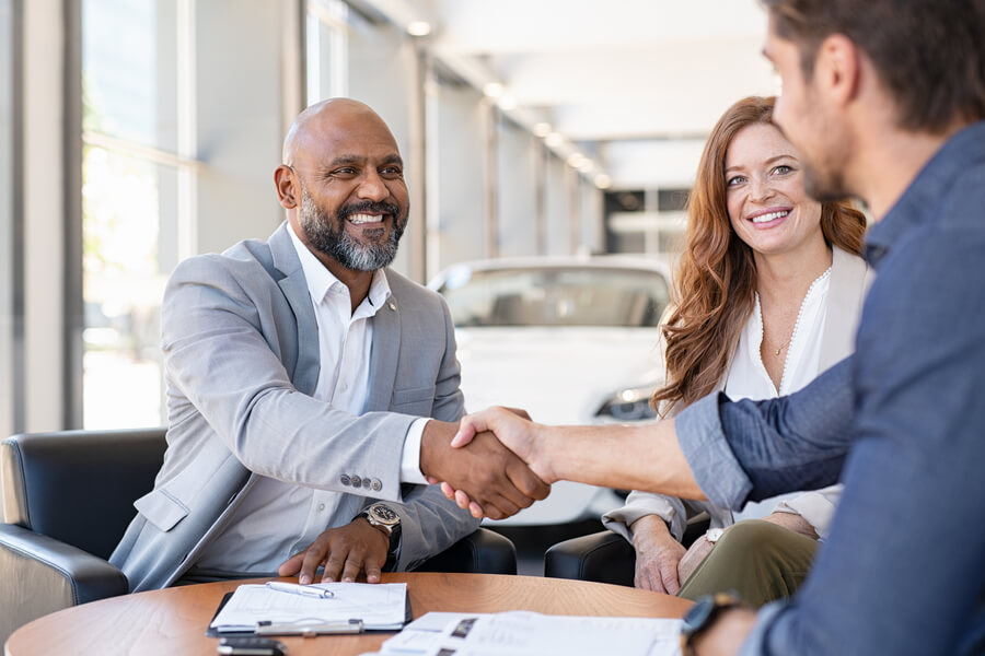 Pre owned cars for sale - Professionals collaborating during a business meeting