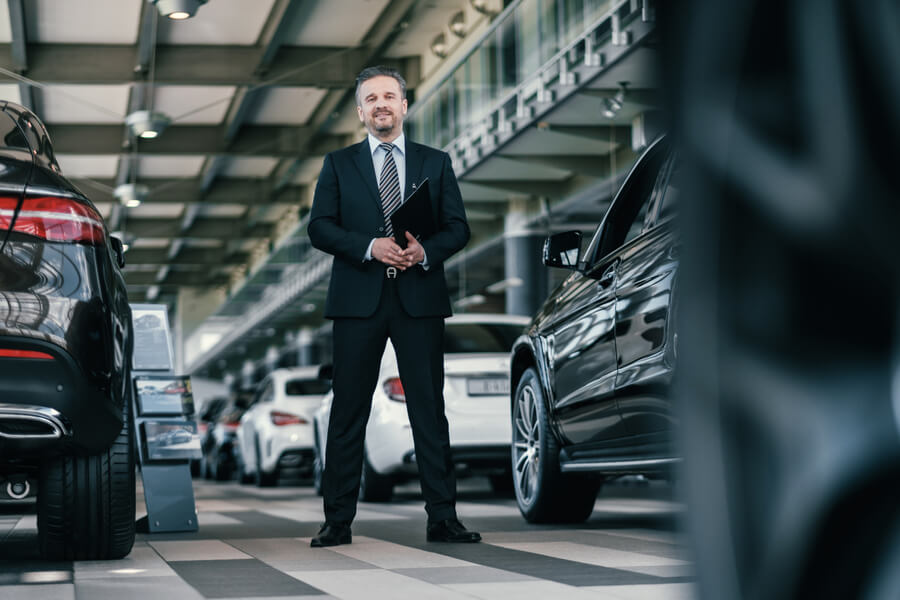 Businessman walking in parking garag