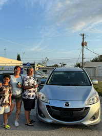 1Drive Inc used car dealership, clients buying their first car for a cheap price at the best used car dealership in Hollywood Fl
