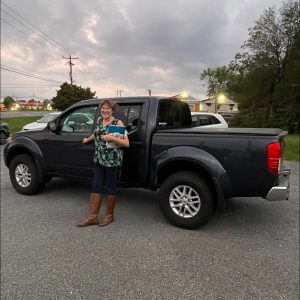 Customer purchasing a used vehicle from Monticello Motors in Charlottesville
