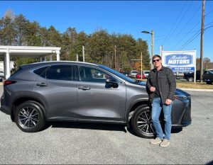 Customer purchasing a used vehicle from Monticello Motors in Charlottesville
