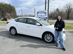 Customer purchasing a used vehicle from Monticello Motors in Charlottesville