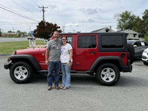 Customer purchasing a used vehicle from Monticello Motors in Charlottesville