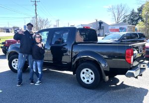 Customer purchasing a used vehicle from Monticello Motors in Charlottesville
