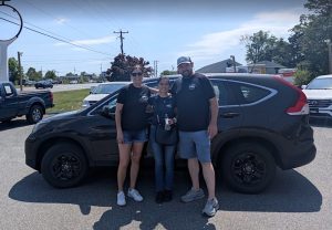 Customer purchasing a used vehicle from Monticello Motors in Charlottesville