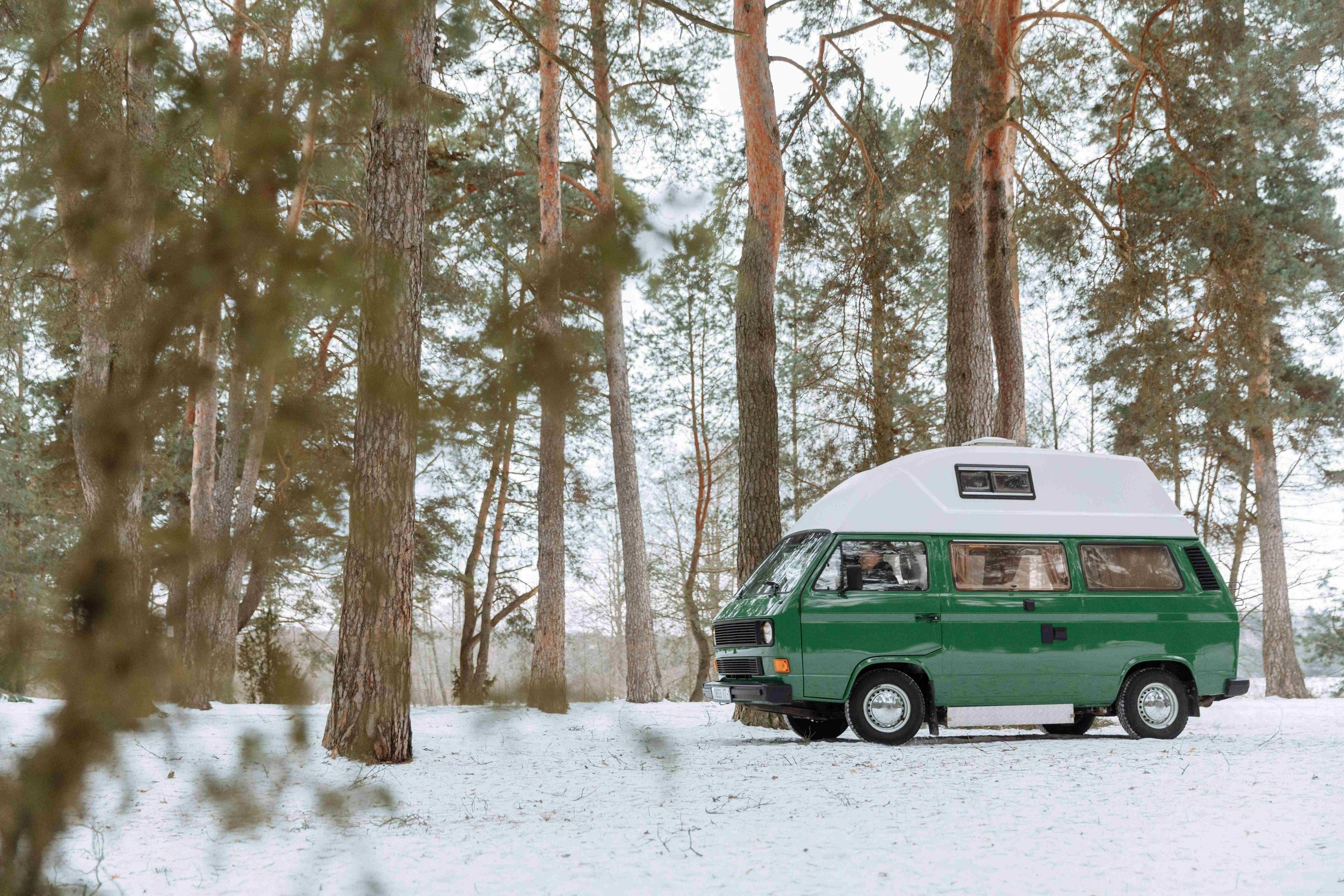 RV camper in the snow after winterization protection