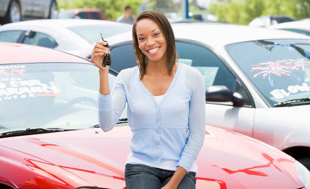 Woman carefully selecting her ideal car from a range of options at Auto Moto Deals dealership