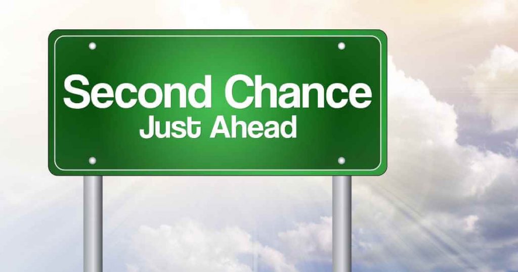 a sign reading "second chance just ahead"