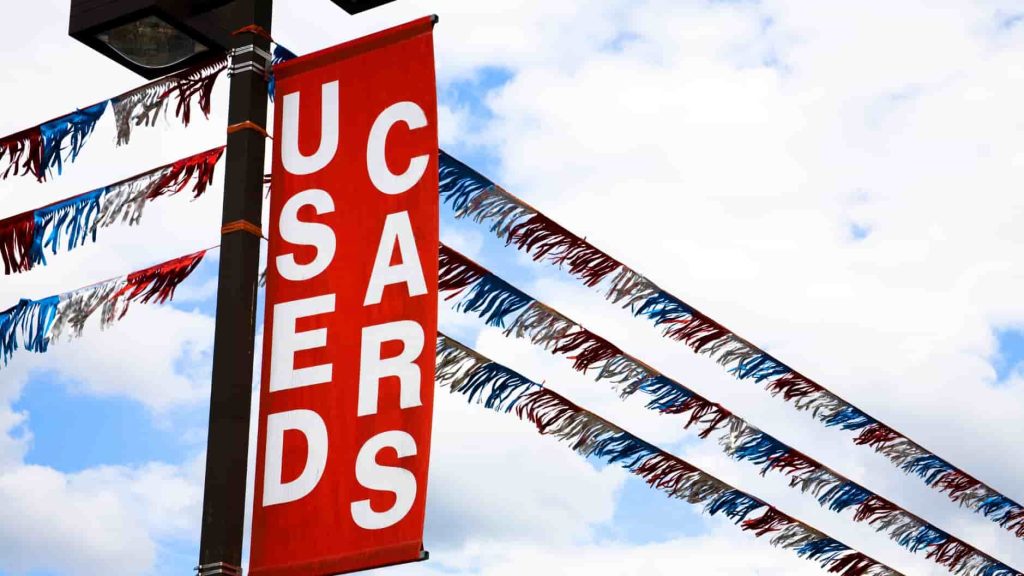 a banner that says used cars at a dealership promoting financial freedom