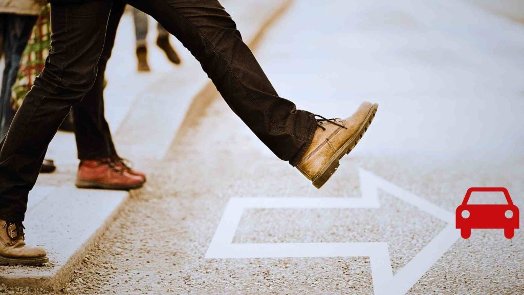 a man taking a step towards an arrow that leads to a car without a cosigner