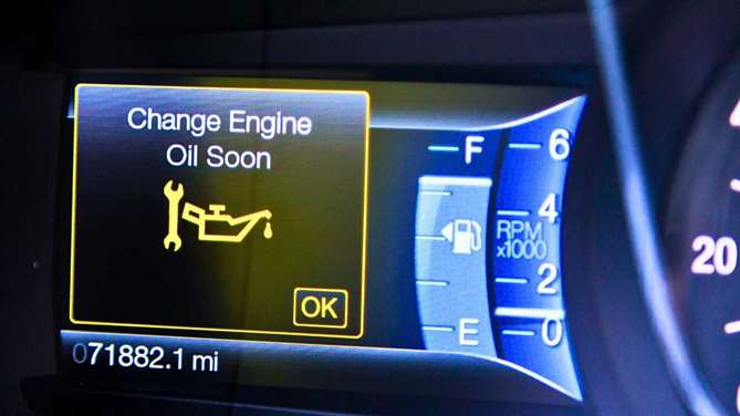 a warning on a used car cluster stating that an oil change is needed soon