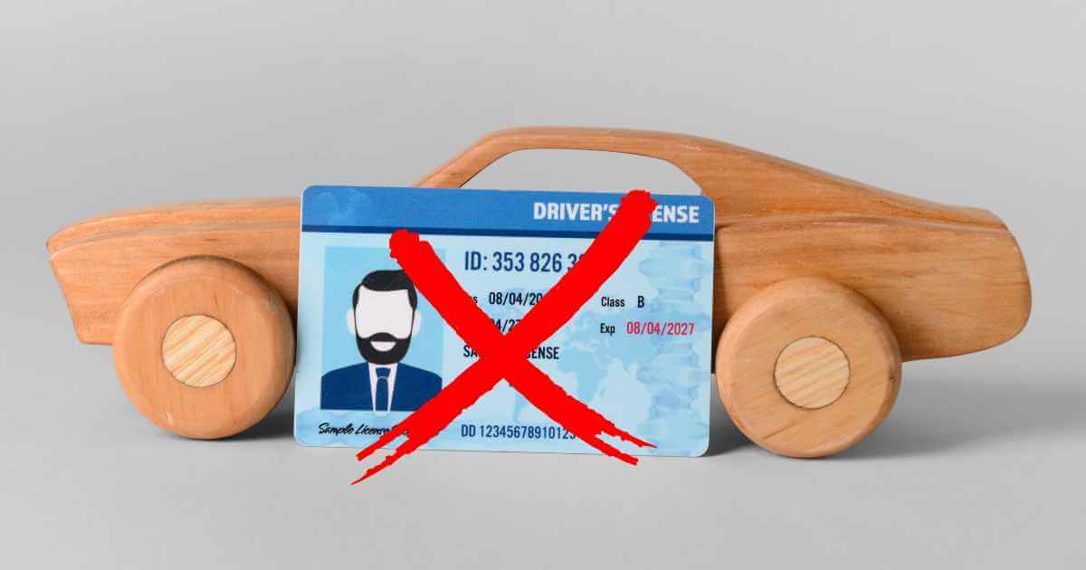 an image of a wood toy car with driver's license in front of it and an X over that signifying finding car lots no license needed
