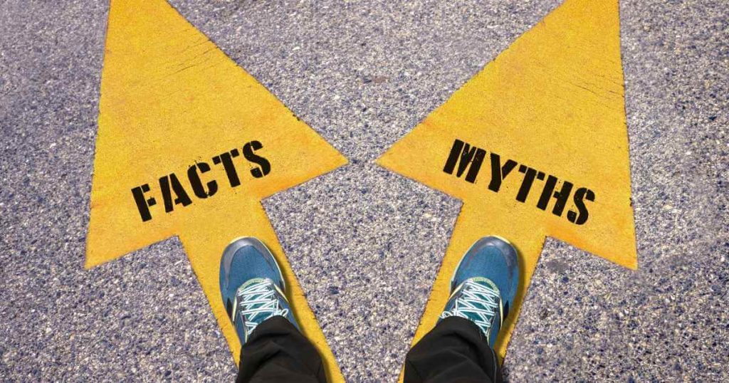 two feet on top of yellow arrows that read "facts" and "myths" revolving car lots no license needed