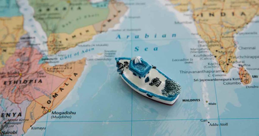 a toy ship on top of a map showing someone navigating the realm of car lots no license needed