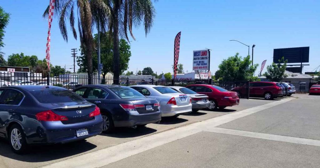 an image of Westland Auto Sales and rows of its cars at the best in house car lot fresno offers