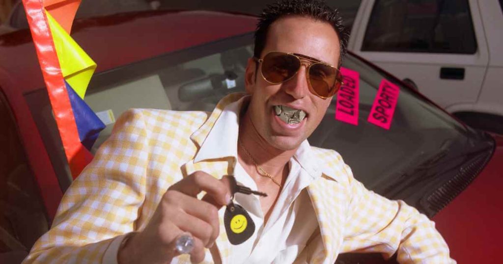 a sleezy looking used car salesman with a cigar and dollar bills in his mouth showing the average car payment for used cars