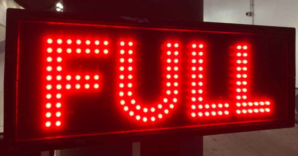 a neon sign that reads "full" depicting the full car maintenance checklist