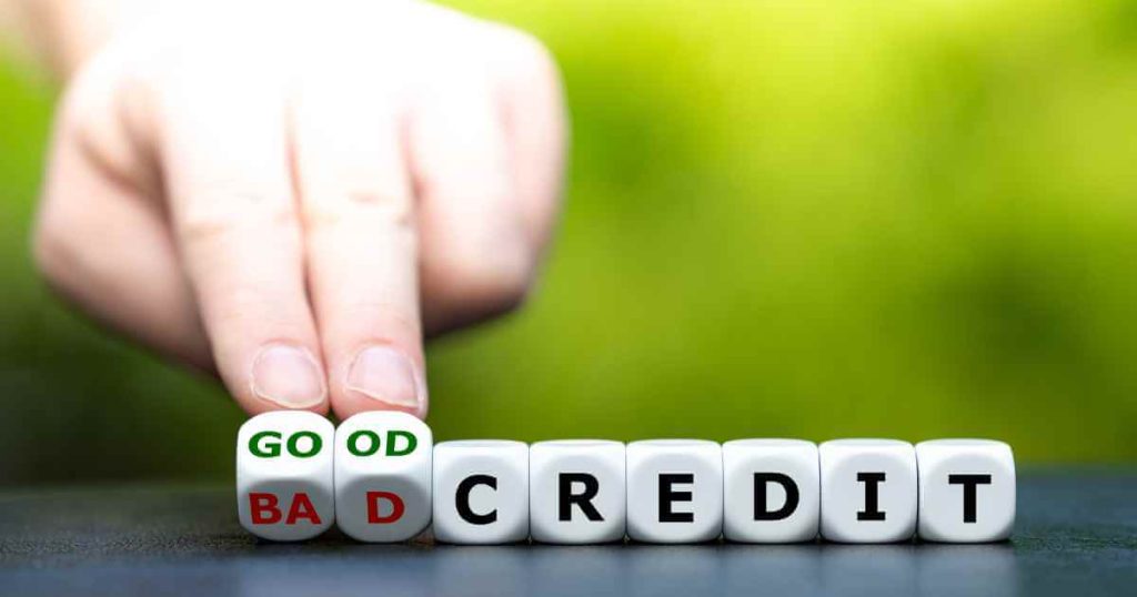 a picture of fingers pushing dice with the word "good" and "bad" and "credit" depicting the intro to improve your credit for car loans