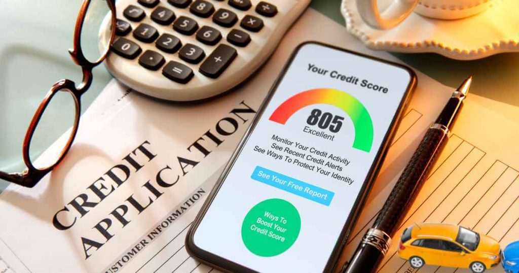 an image of a credit application with a phone with a credit score on it and toy cars by it showing tips to improve your credit for car loans
