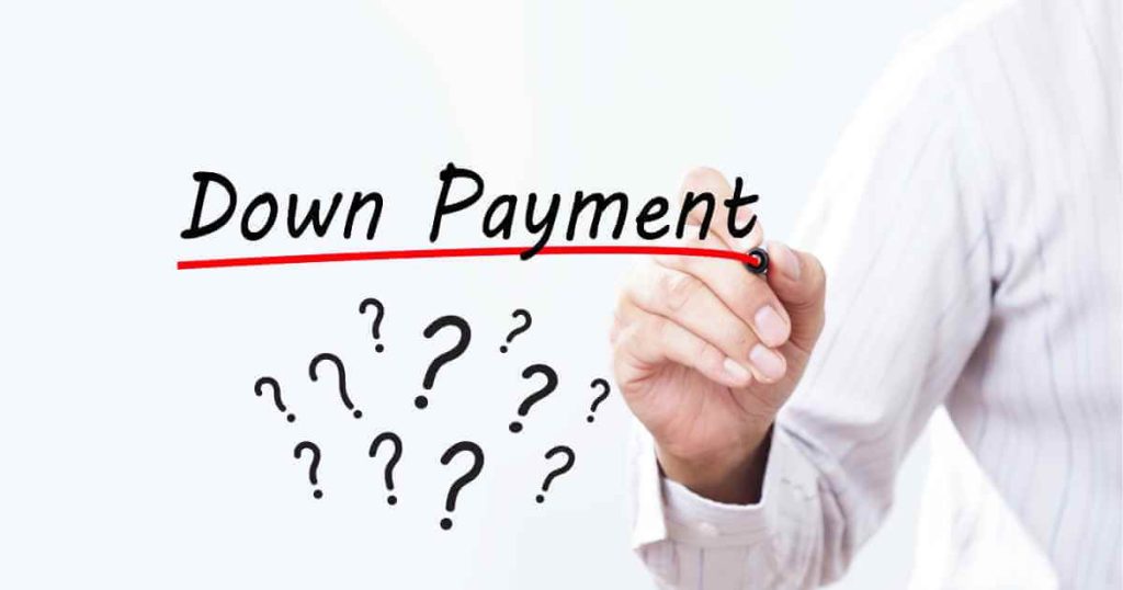 a hand underlining in red the words "down payment" with question marks below