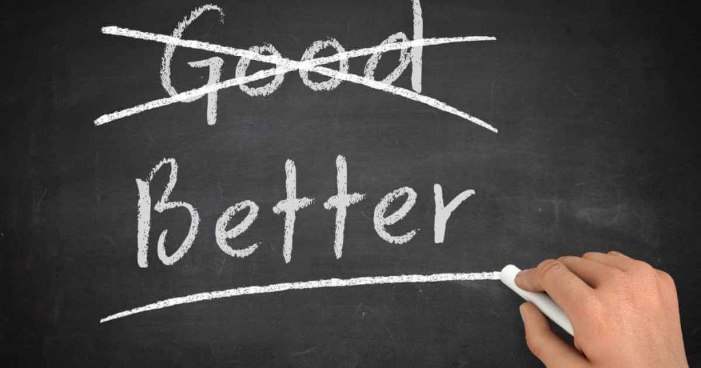 the word "good" crossed out on a chalkboard with the word "better" underlined below showing how buying a used car is better