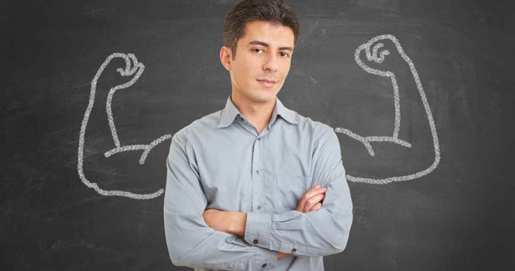 a man with his arms crossed and a confident expression with muscular arms drawn behind him