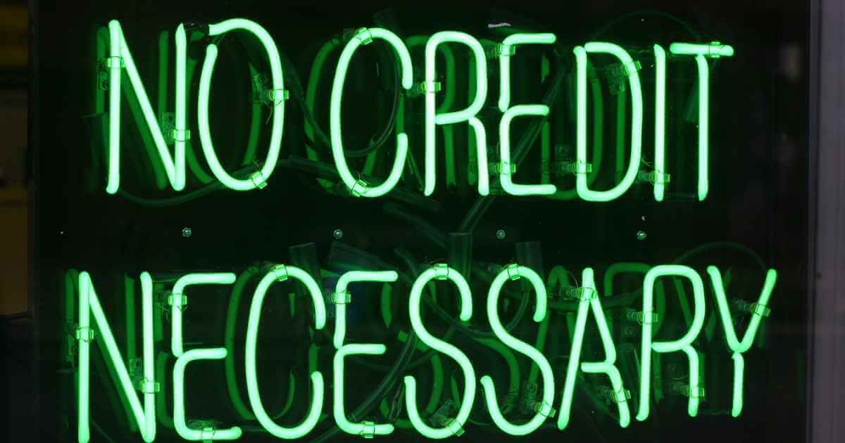 a neon sign that reads "no credit necessary" for no credit car dealerships near me