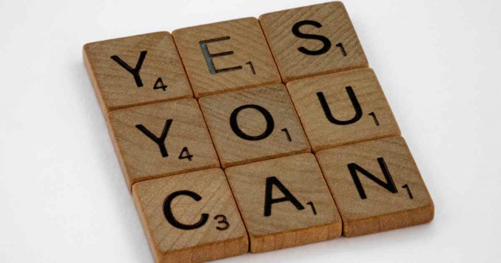 wooden blocks that read "yes you can"