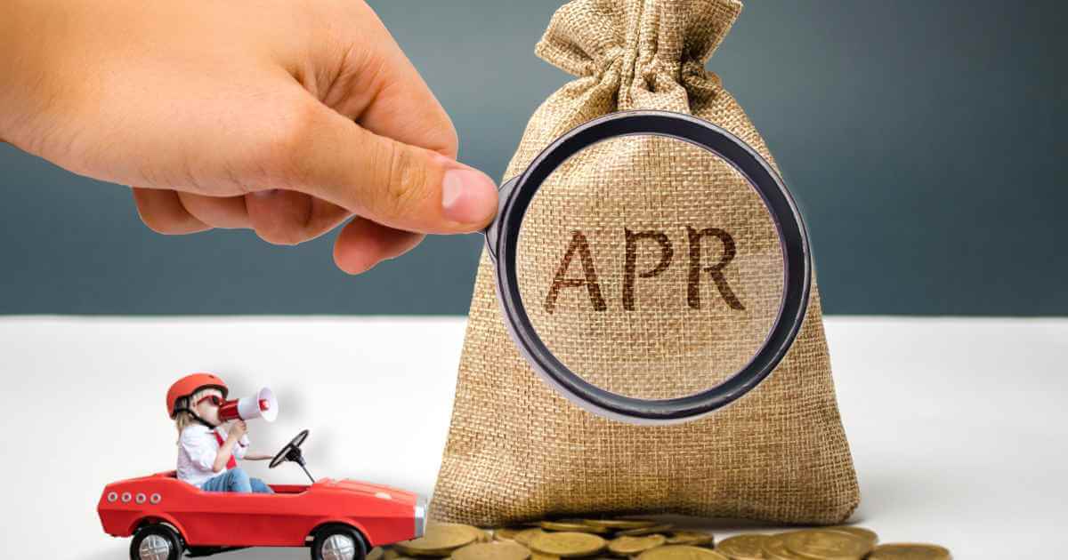 a bag of coins with the word "APR" written on it and a toy car next to it depicting car loan APR