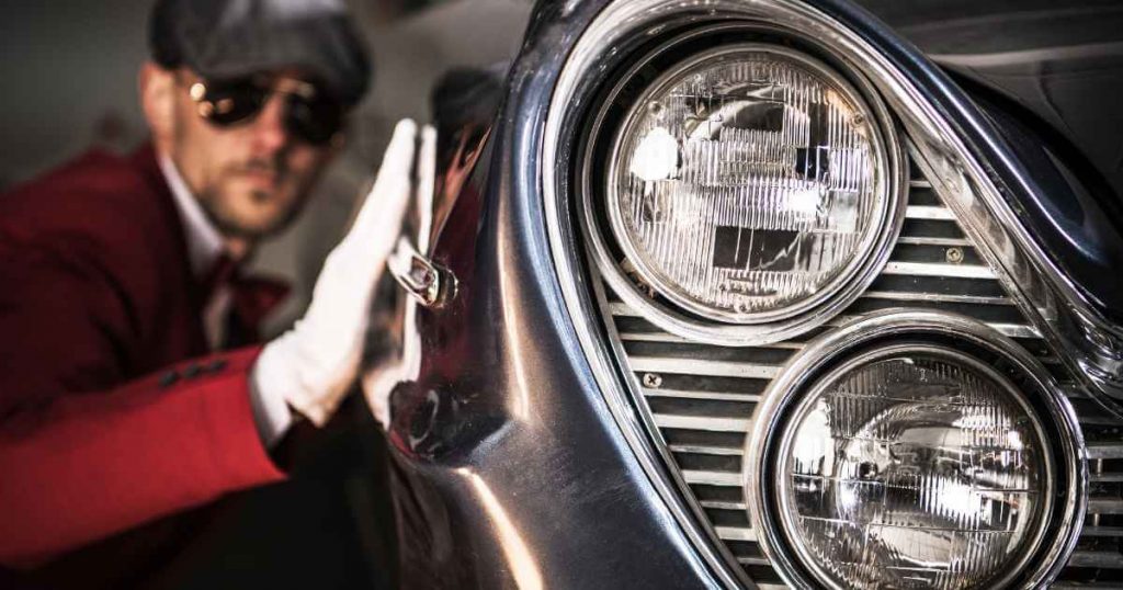 a man cleaning a pristine cars for sale to maintain its resale value in Fresno