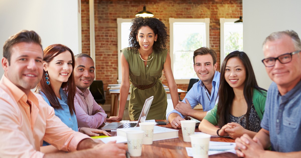 a team of vehicle and credit consultants holding a great meeting with their manager 