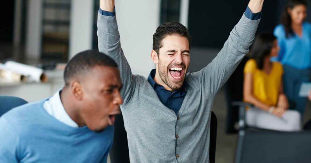 two men cheering after getting cars plus credit vehicles