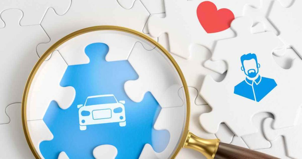 a magnifying glass over a puzzle of a car and a person with a heart next to it showing there is a lifeline after finding dealerships that work with repos